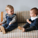 Baby girl wearing Lalaby Lucy set in whale blue cotton baby corduroy