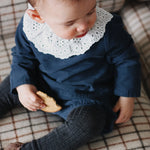 Baby girl wearing Lalaby Lucy set in whale blue cotton baby corduroy