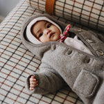 Baby wearing Lalaby Mio balaclava in powder pink cashmere