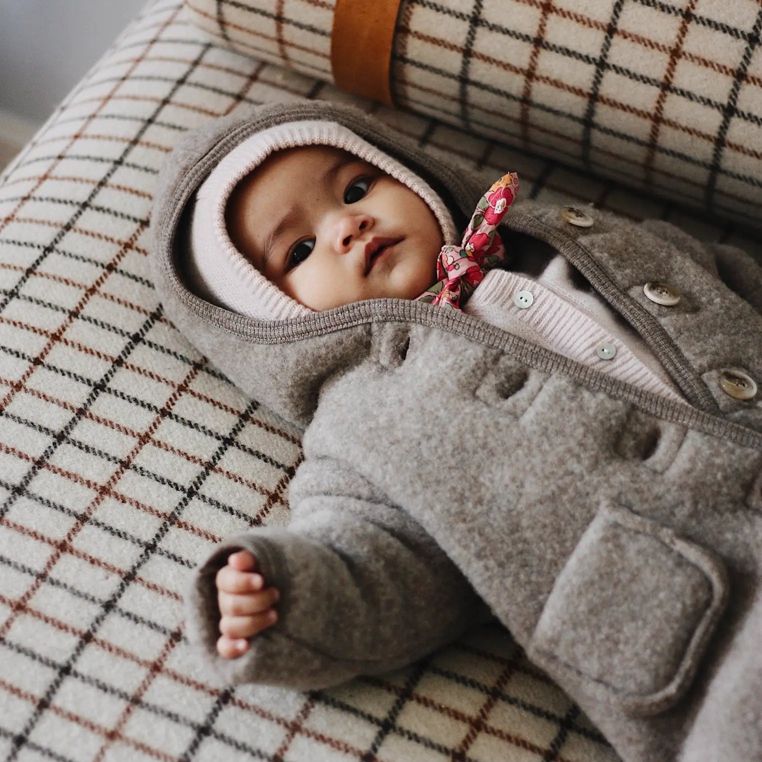 Baby wearing Lalaby Mio balaclava in powder pink cashmere