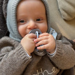 Baby wearing Lalaby Mio balaclava in dove blue cashmere