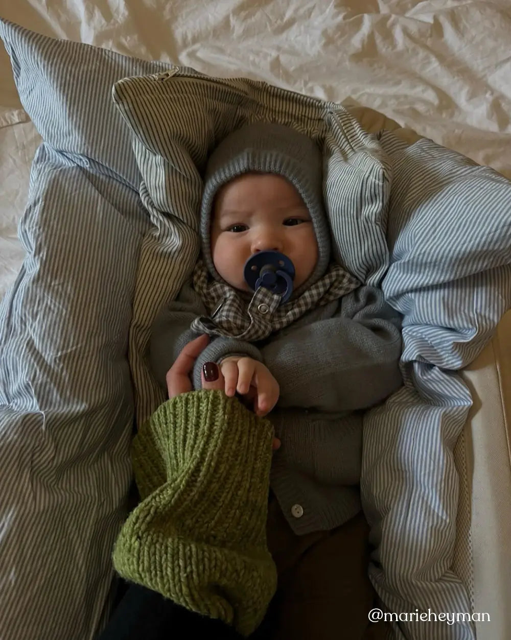 Baby wearing Lalaby Mio balaclava in dove blue cashmere
