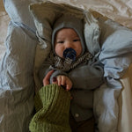 Baby wearing Lalaby Mio balaclava in dove blue cashmere