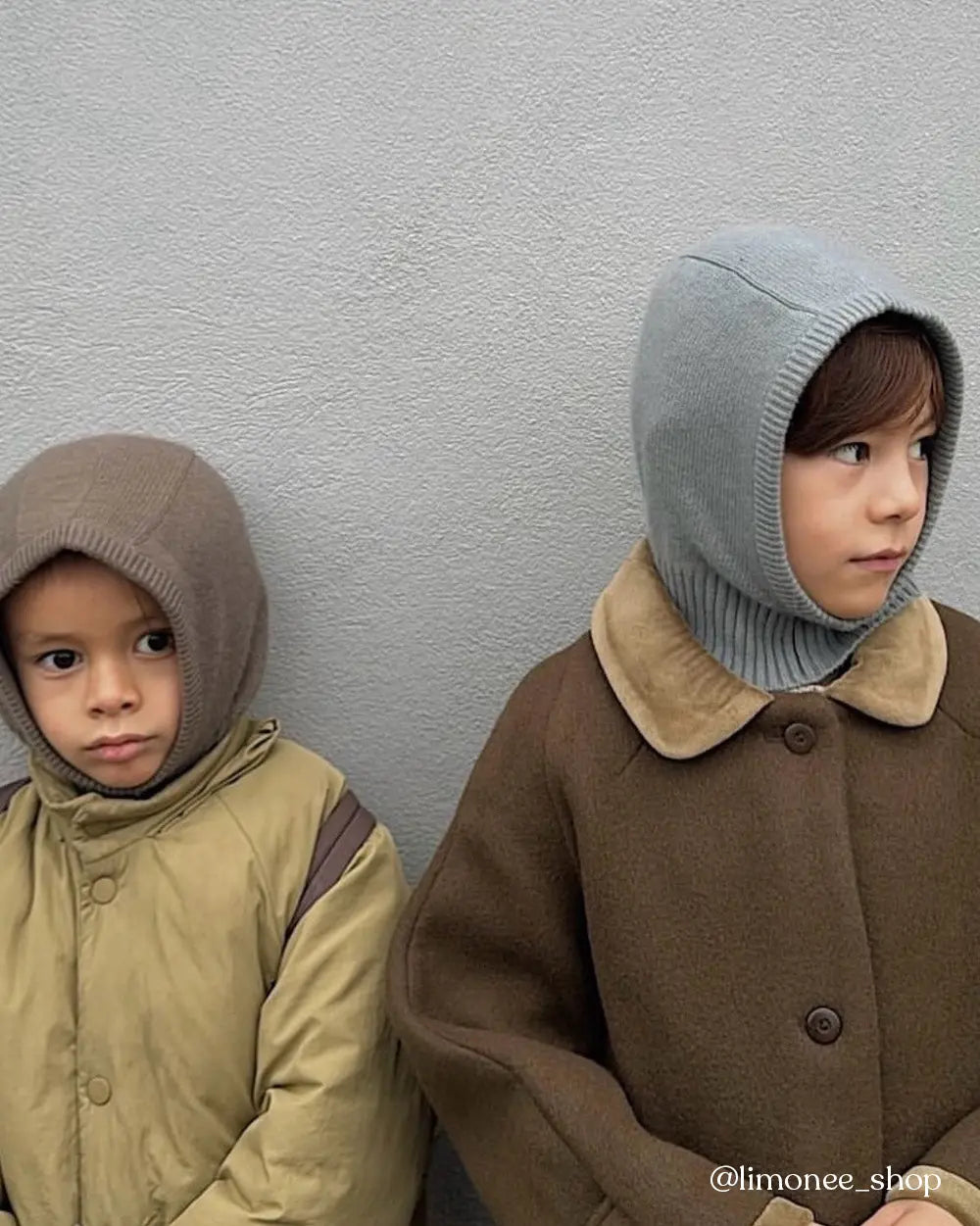 Boys wearing Lalaby Mio balaclavas for babies and kids in dove blue and toast brown cashmere