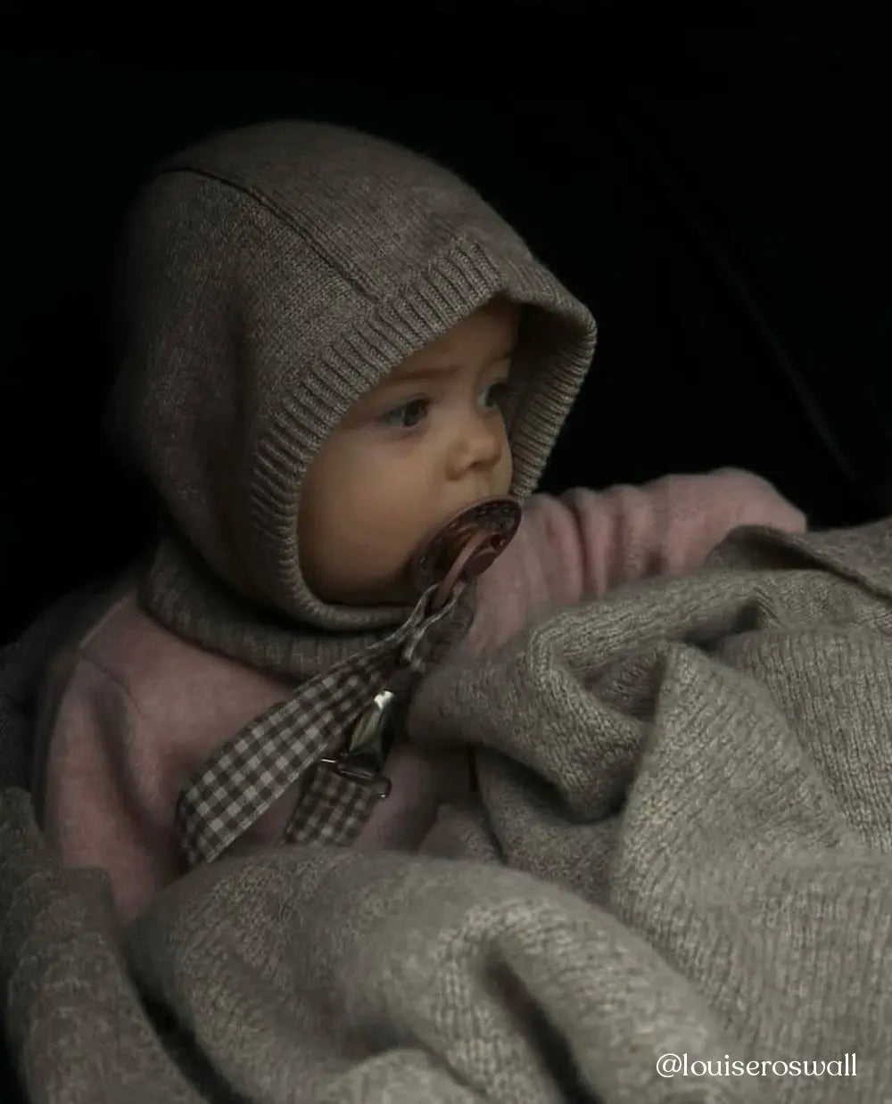 Baby wearing Lalaby Mio balaclava in toast brown cashmere