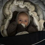 Baby wearing Lalaby Mio balaclava in toast brown cashmere