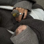 Baby wearing Lalaby Mio balaclava in toast brown cashmere