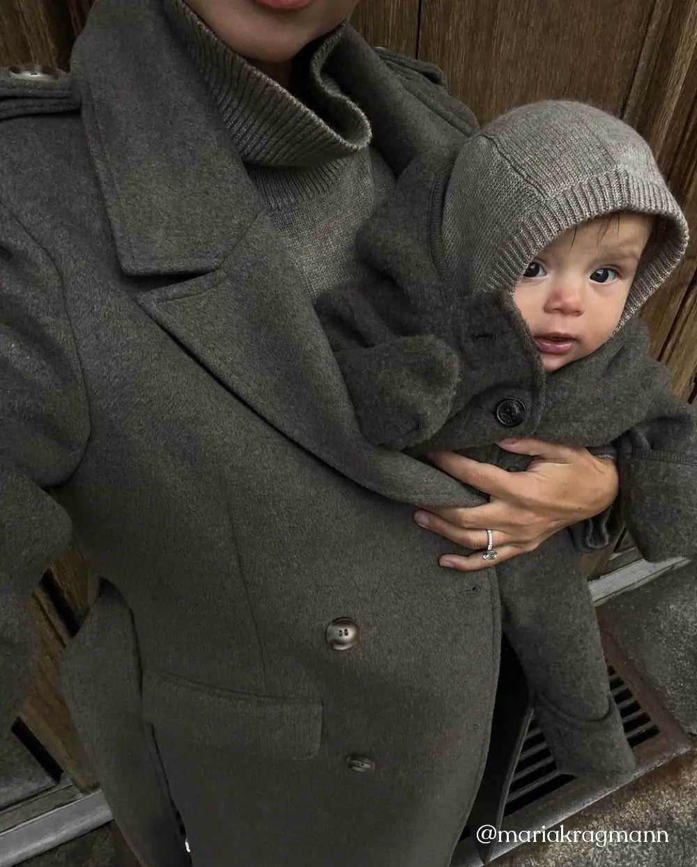 Baby wearing Lalaby Mio balaclava in toast brown cashmere