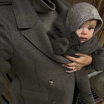 Baby wearing Lalaby Mio balaclava in toast brown cashmere