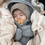 Baby wearing Lalaby Mio balaclava in toast brown cashmere