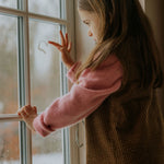 Girl wearing Lalaby Mumle dress for kids in cookie brown organic cotton mega cord