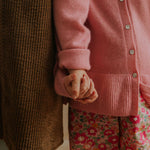 Girl wearing Lalaby Mumle dress for kids in cookie brown organic cotton mega cord