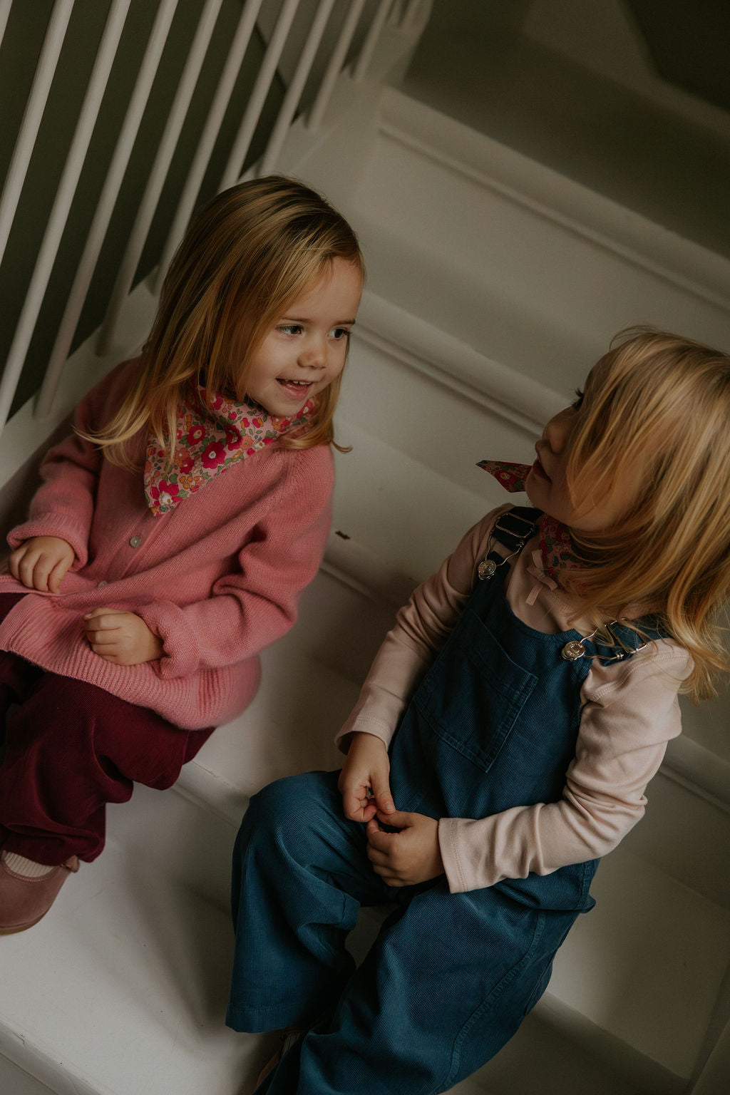 Girl wearing Lalaby Oda cardigan in sorbet pink cashmere