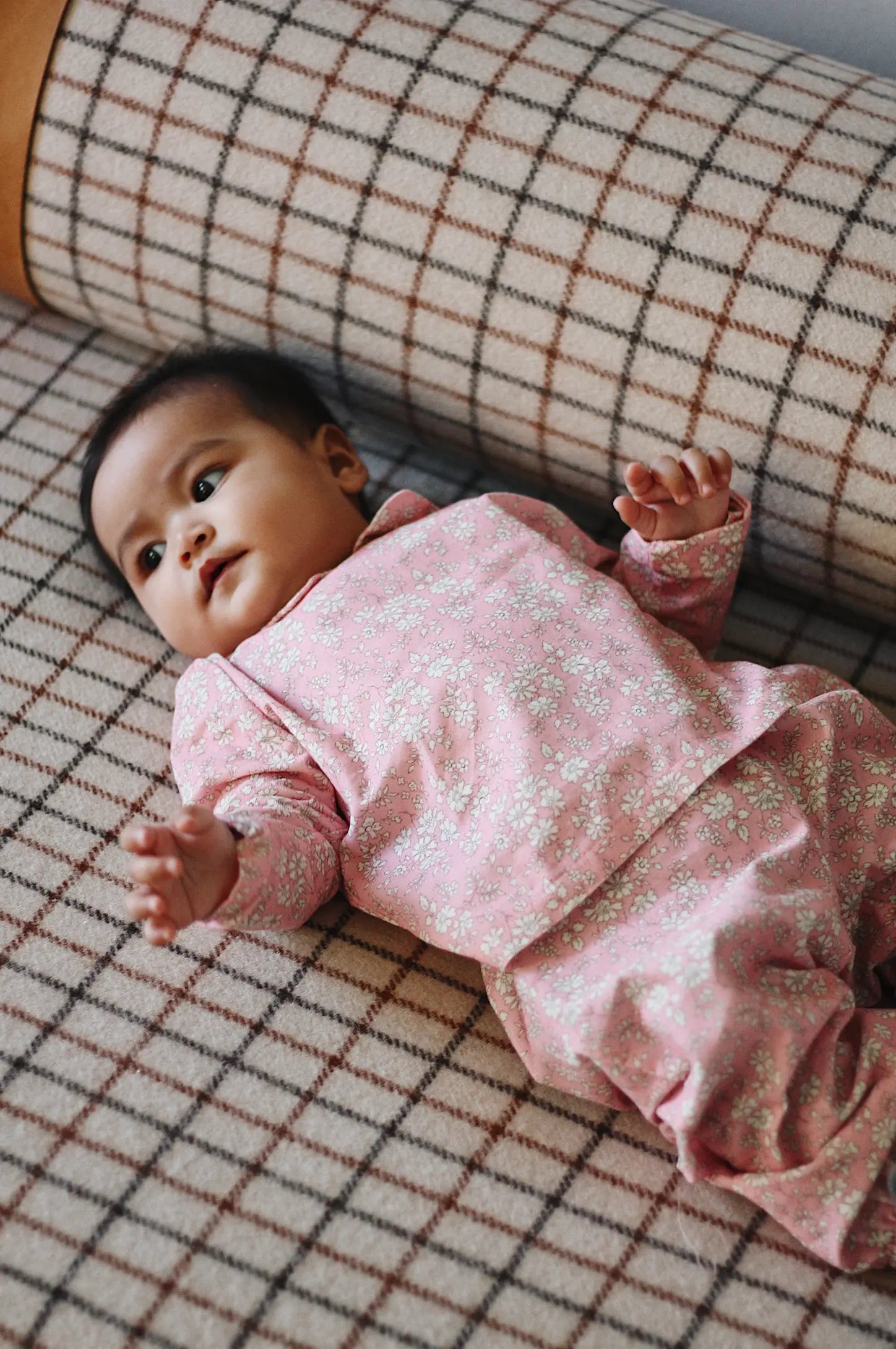 Baby girl wearing Lalaby Oya baby top in pink flower cotton liberty corduroy 