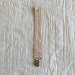 Lalaby pacifier clip for babies in blush pink organic cotton