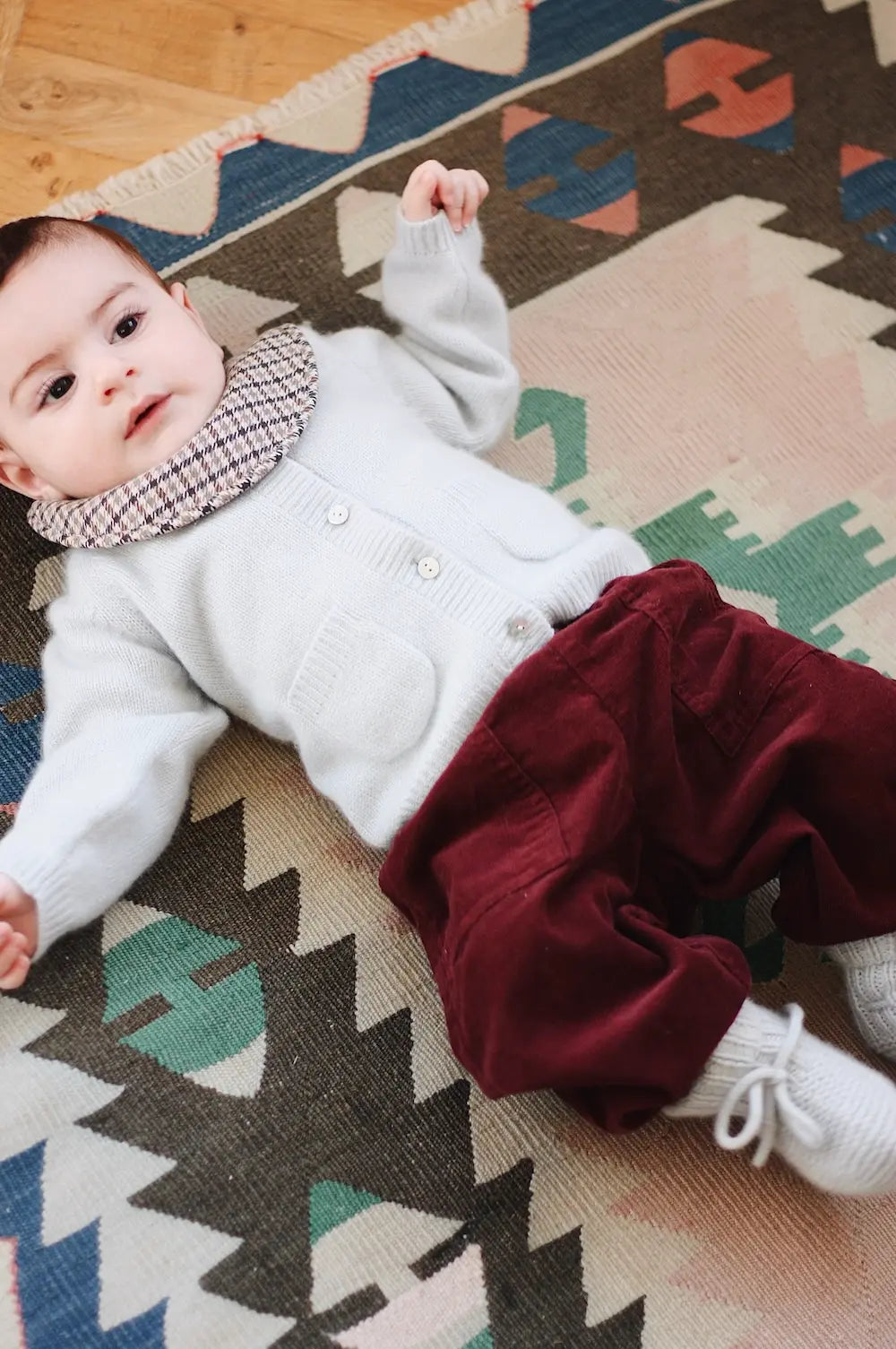 Baby boy wearing Lalaby Panda pants in ruby red cotton baby corduroy