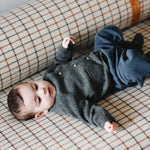 Baby boy wearing Lalaby Panda pants in whale blue cotton baby corduroy