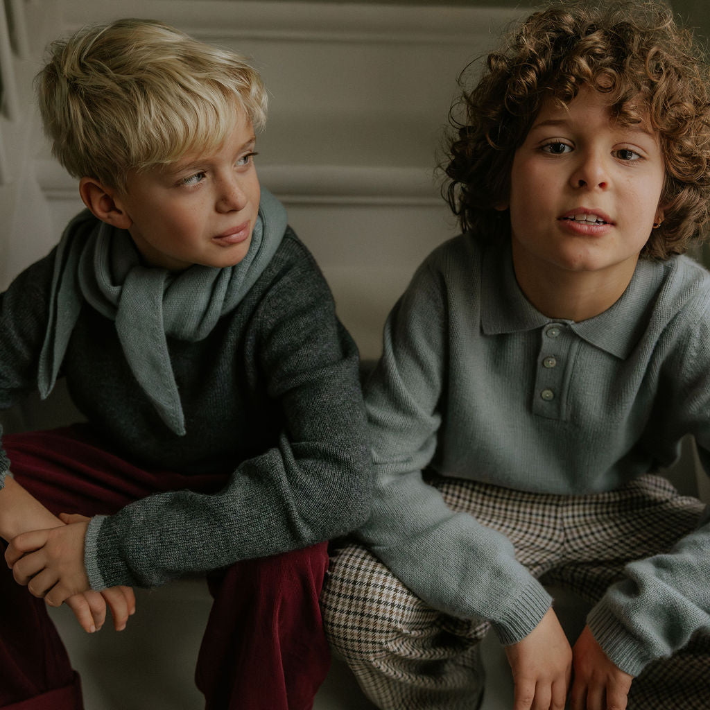 Boy wearing Lalaby knitted Pauli polo for kids in dove blue cashmere