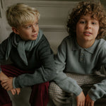 Boy wearing Lalaby knitted Pauli polo for kids in dove blue cashmere