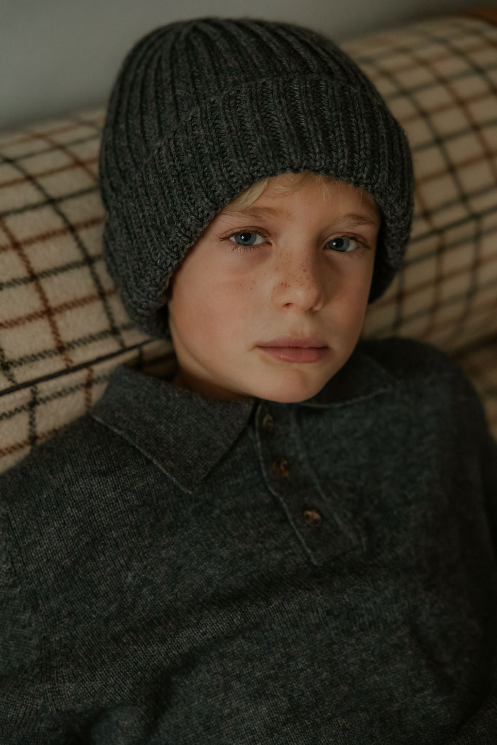 Boy wearing Lalaby Pauli polo in storm grey cashmere