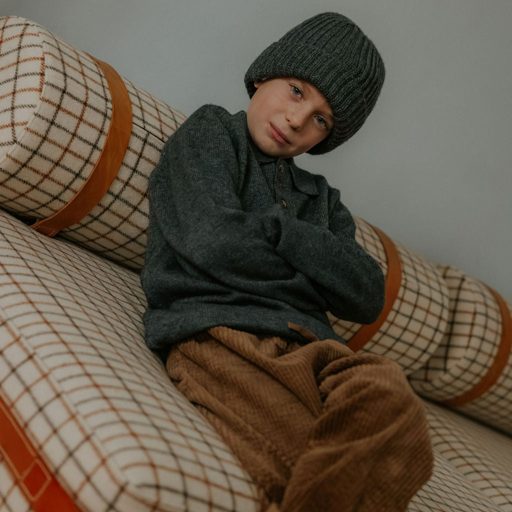Boy wearing Lalaby Pauli polo in storm grey cashmere