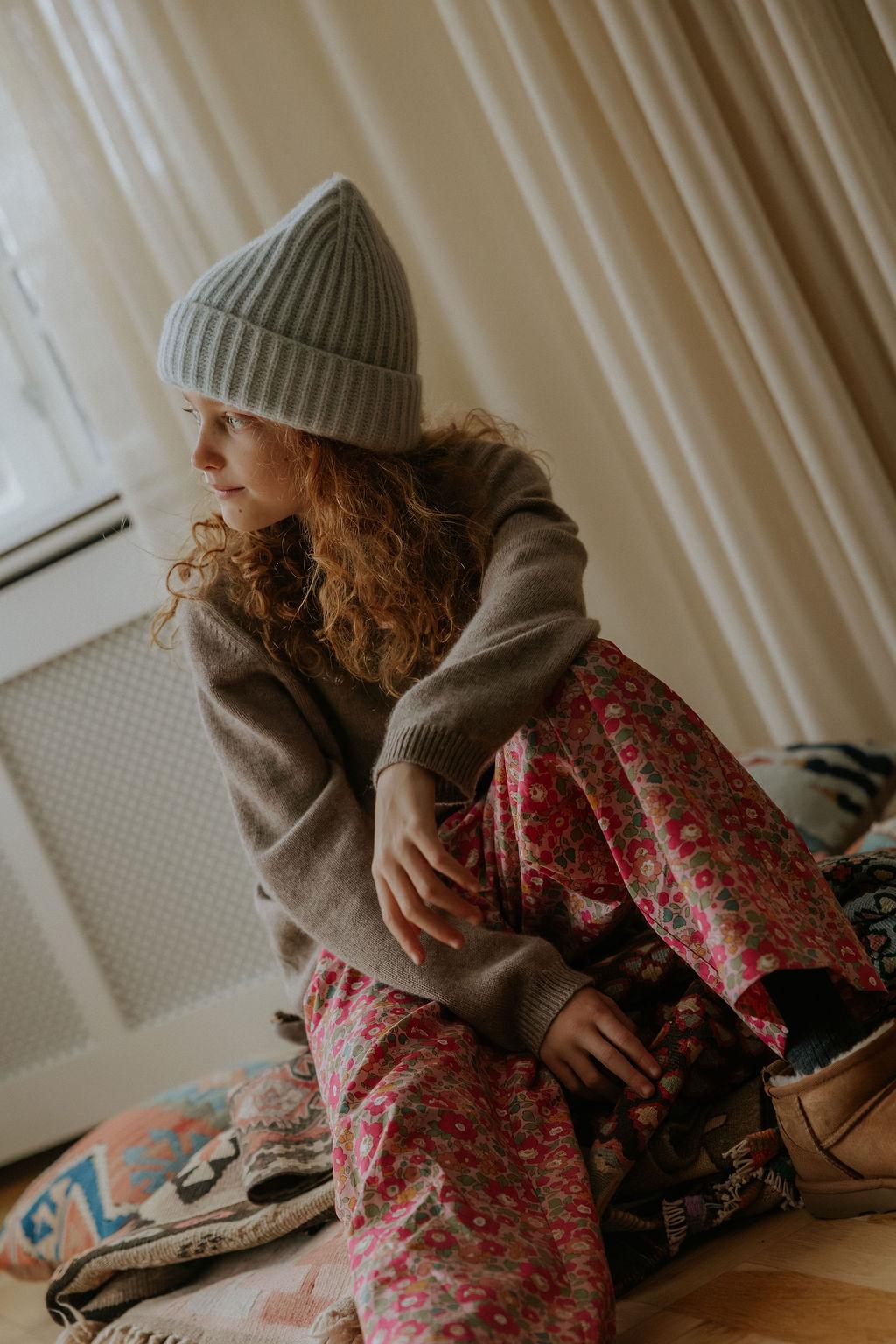 Girl wearing Lalaby Pauli polo in toast brown cashmere