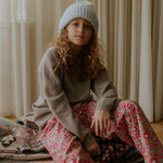 Girl wearing Lalaby Pauli polo in toast brown cashmere