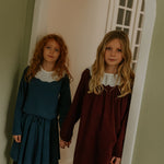 Girl wearing Lalaby Petra skirt for kids in whale blue cotton baby cord