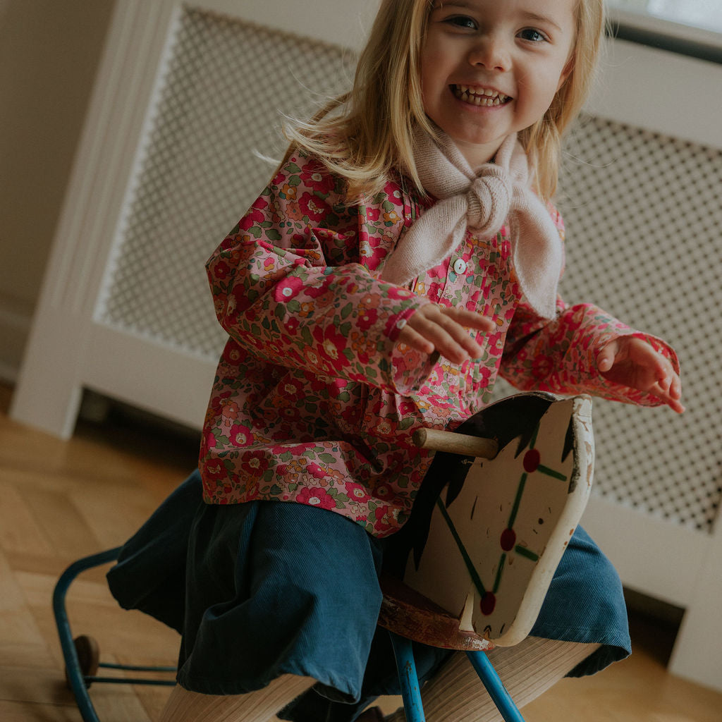 Girl wearing Lalaby Petra kids skirt in whale blue cotton baby cord