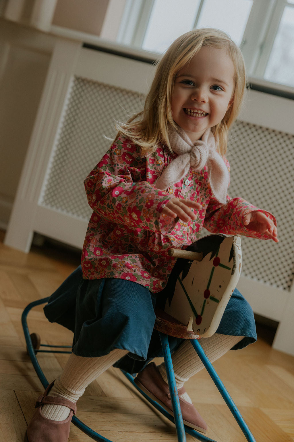 Girl wearing Lalaby Petra kids skirt in whale blue cotton baby cord