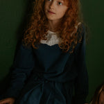 Girl wearing Lalaby Petra kids skirt in whale blue cotton baby cord