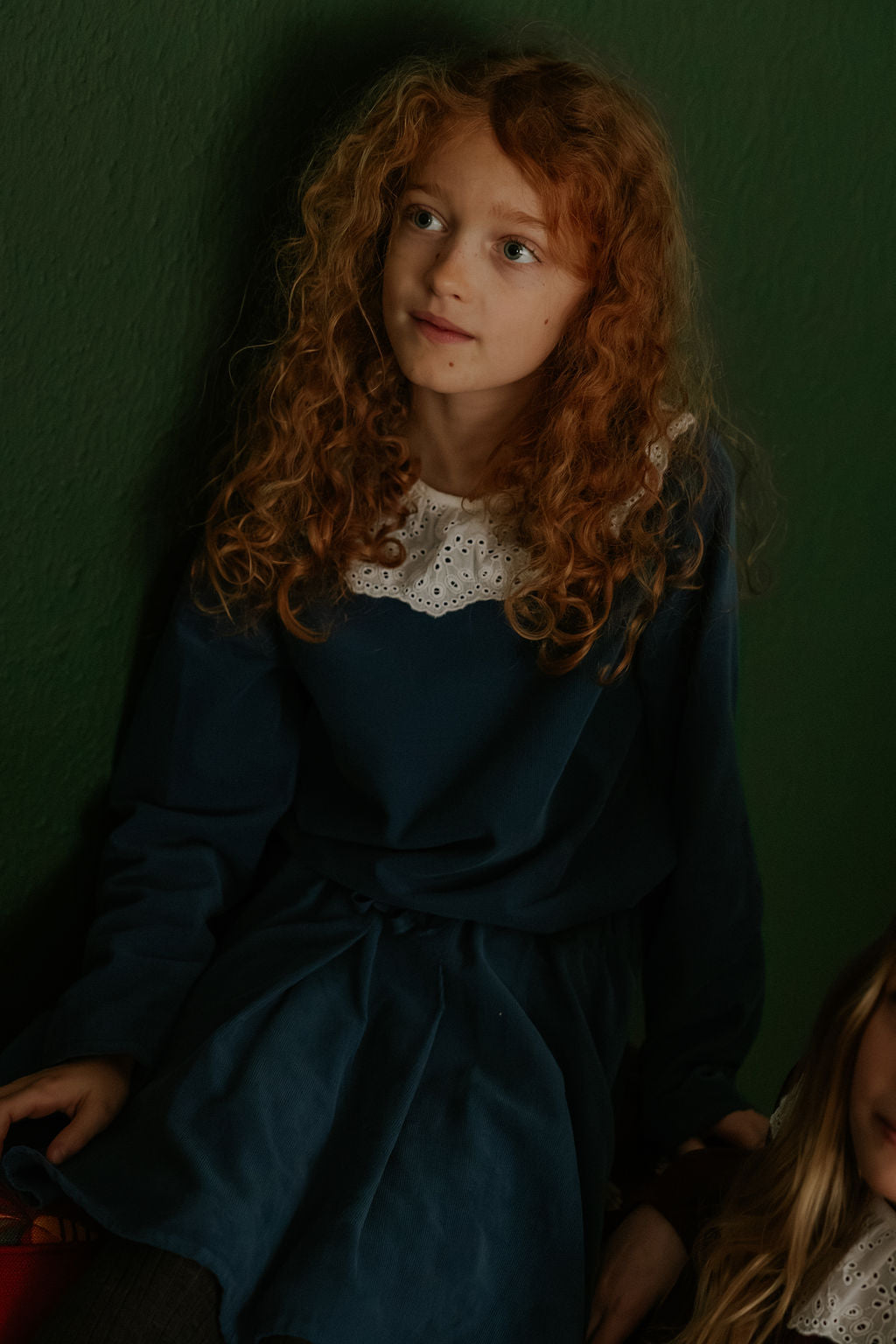 Girl wearing Lalaby Petra kids skirt in whale blue cotton baby cord