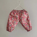 Lalaby Pixi pants for babies in berry betsy pink liberty organic cotton