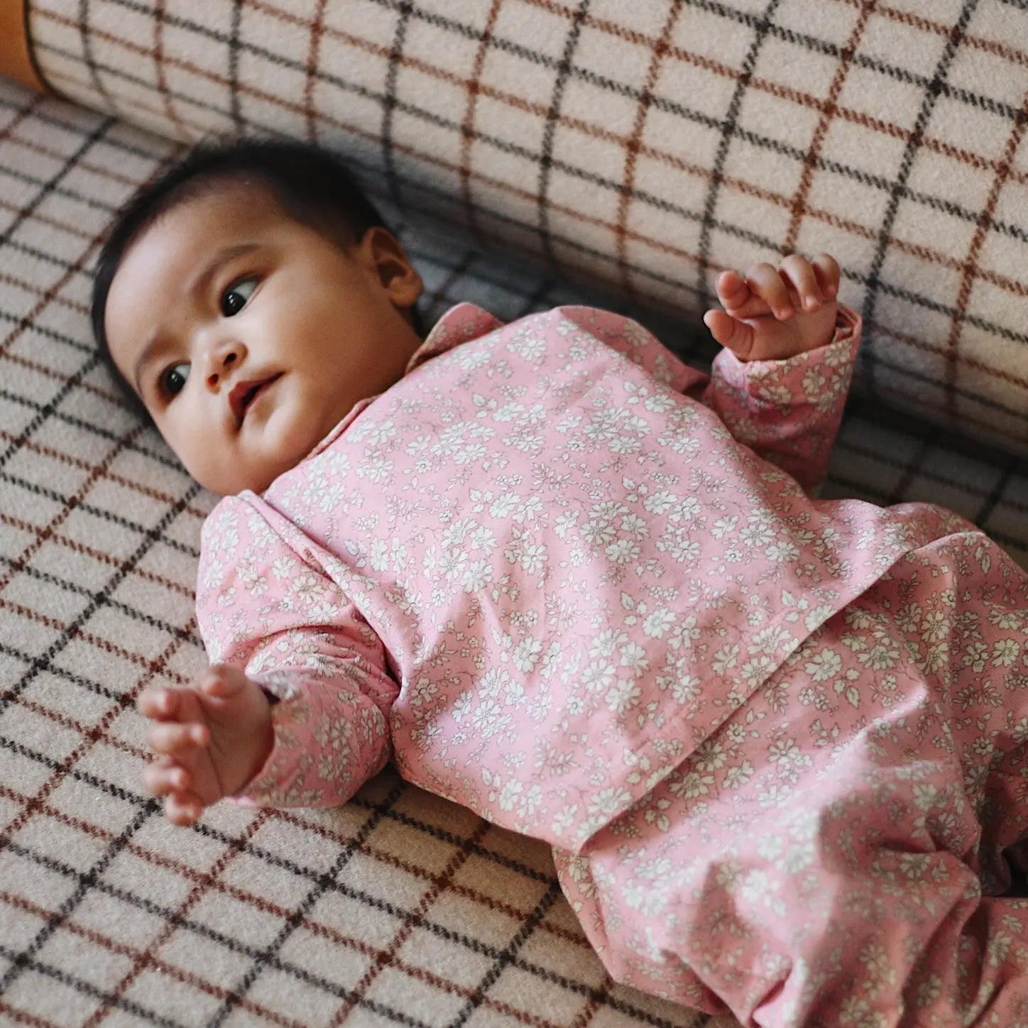 Baby girl wearing Lalaby Pixi pants in pink flower cotton liberty corduroy