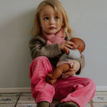 Girl wearing Lalaby Rita scarf in sorbet pink cashmere