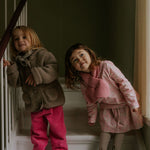 Girl wearing Lalaby Rita scarf in sorbet pink cashmere