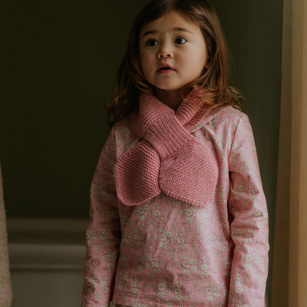 Girl wearing Lalaby Rita scarf in sorbet pink cashmere