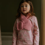 Girl wearing Lalaby Rita scarf in sorbet pink cashmere