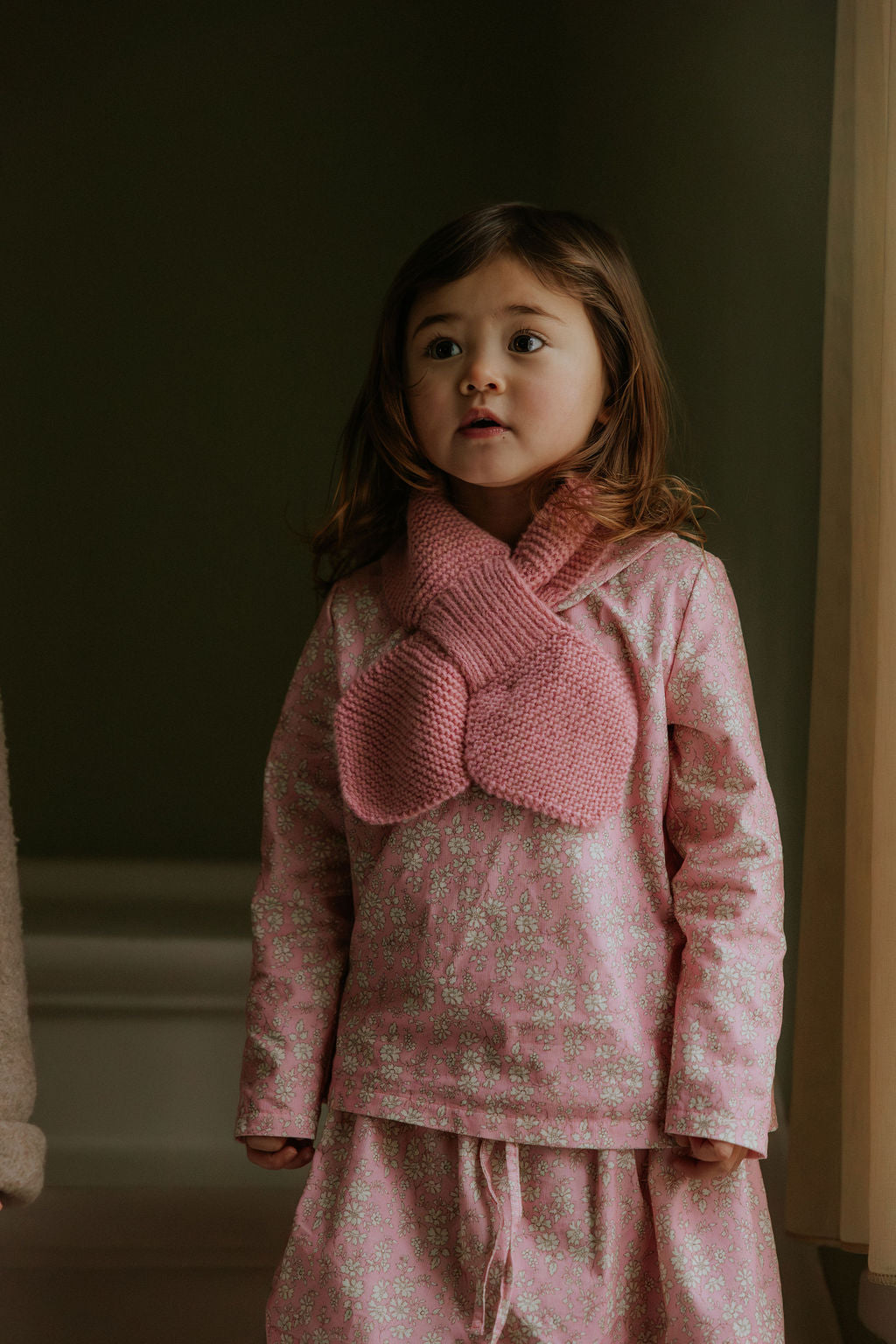 Girl wearing Lalaby Rita scarf in sorbet pink cashmere