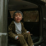 Boy wearing Lalaby Samson kids shirt in forest green organic cotton mega cord