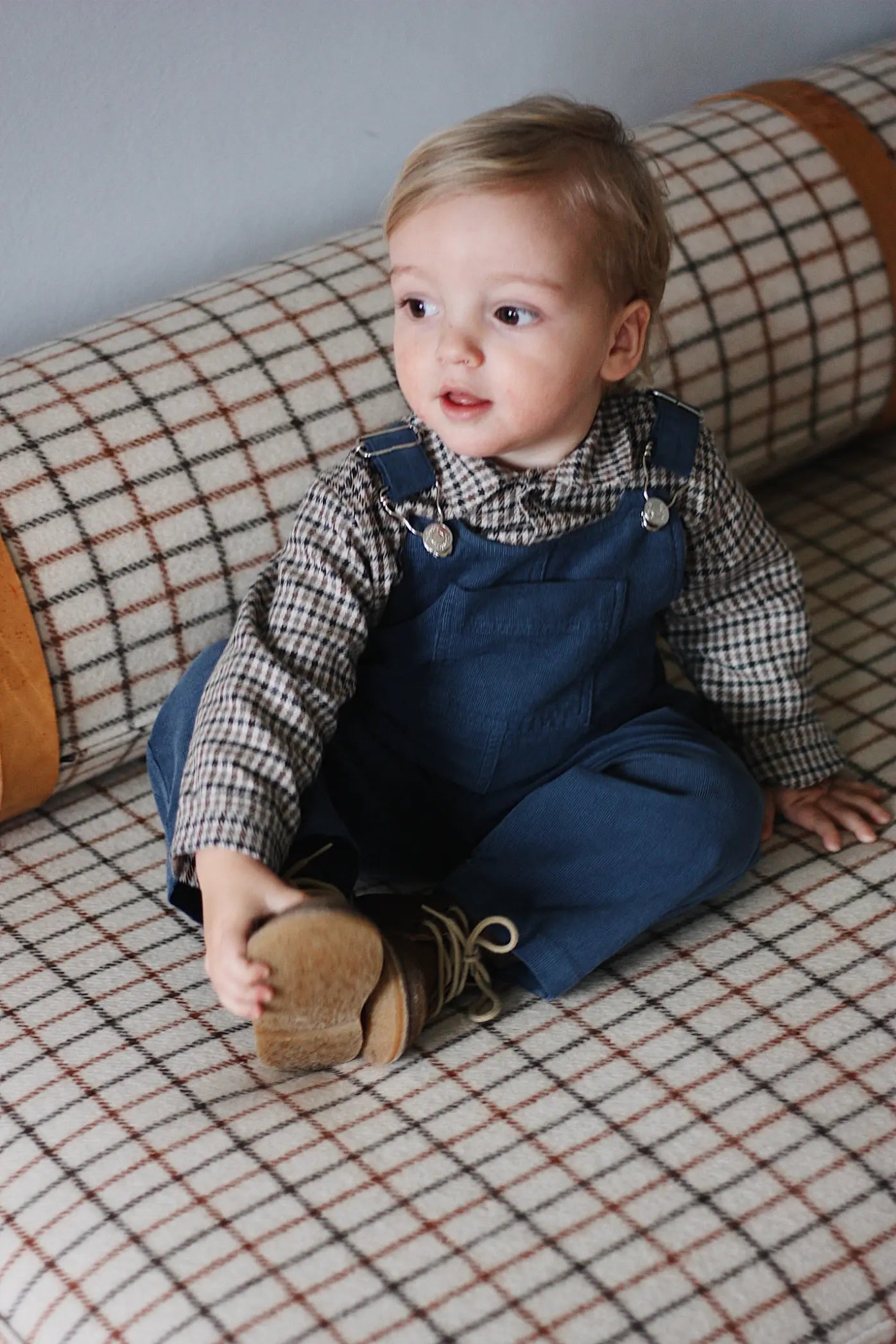 Baby boy wearing Lalaby Saxo baby shirt in tweedy check organic cotton