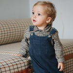 Baby boy wearing Lalaby Saxo baby shirt in tweedy check organic cotton