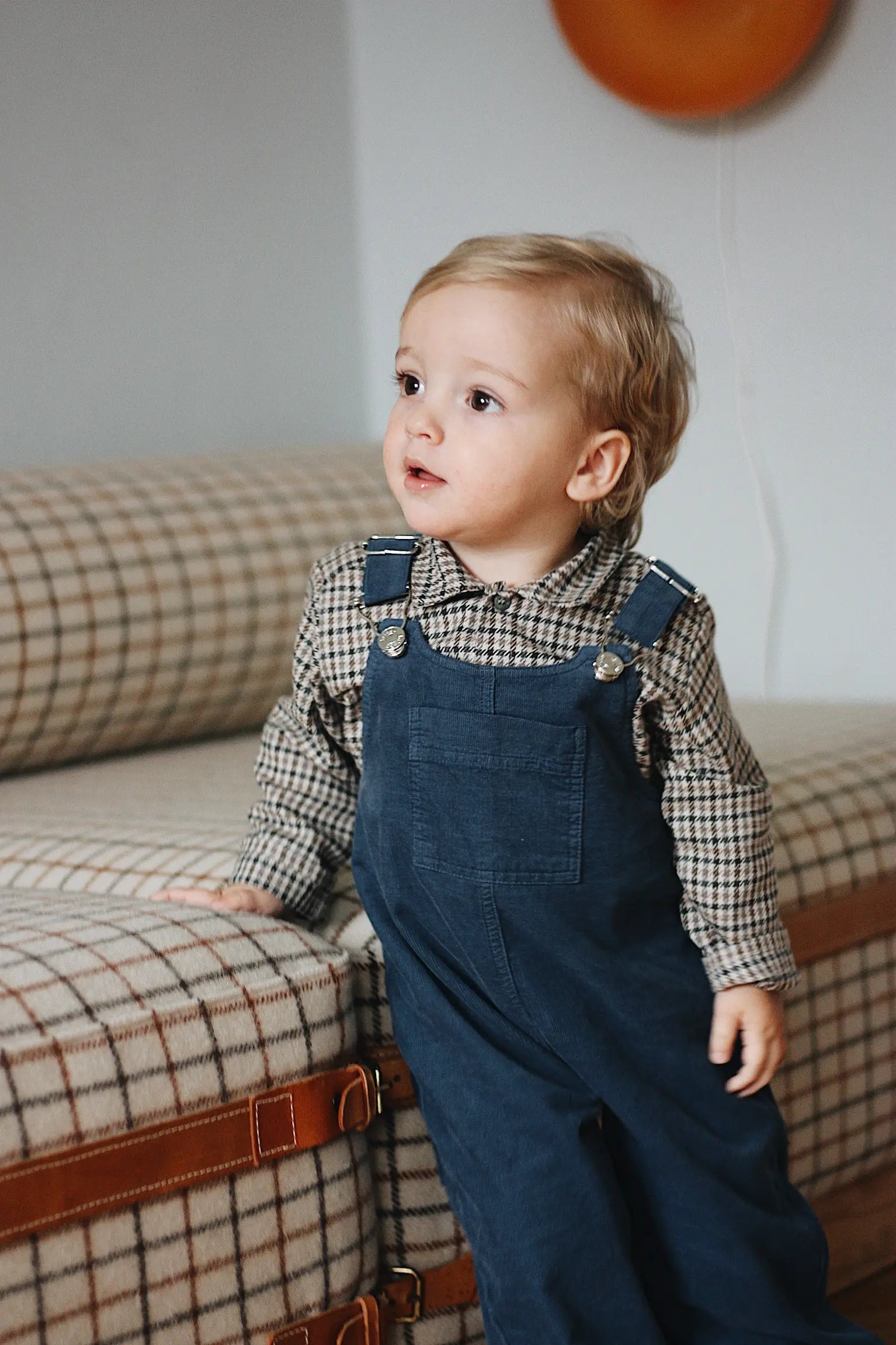 Baby boy wearing Lalaby Saxo baby shirt in tweedy check organic cotton