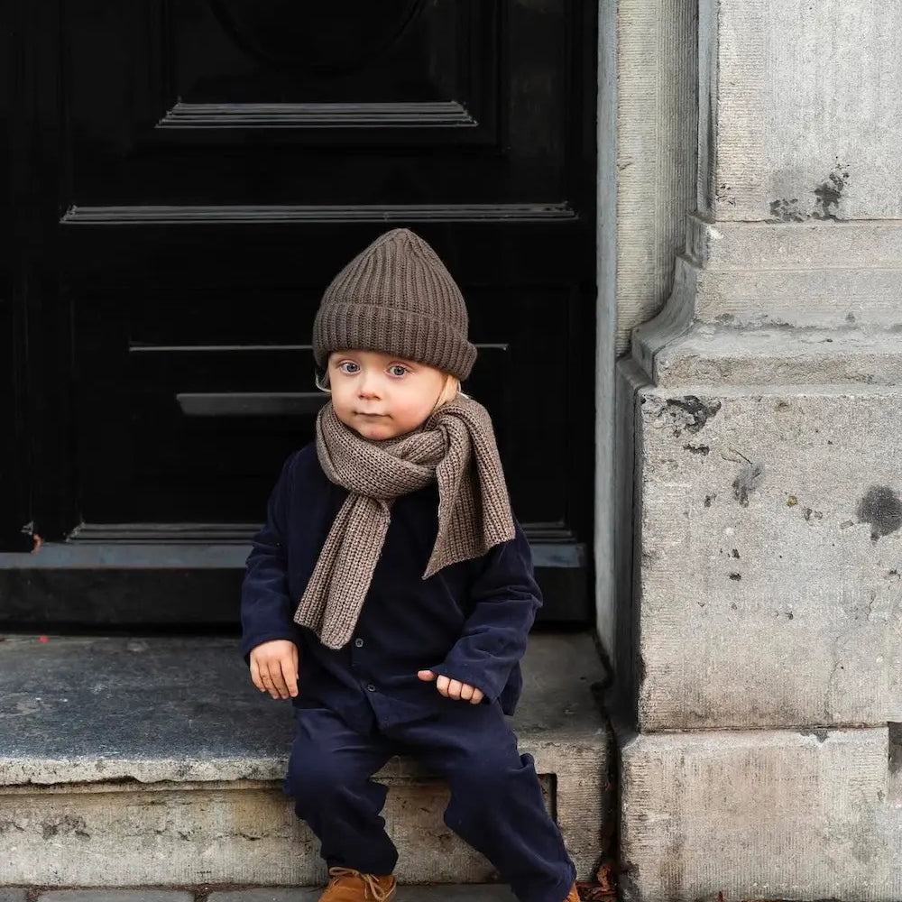 Boy wearing Lalaby Seal scarf in toast brown cashmere