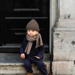 Boy wearing Lalaby Seal scarf in toast brown cashmere