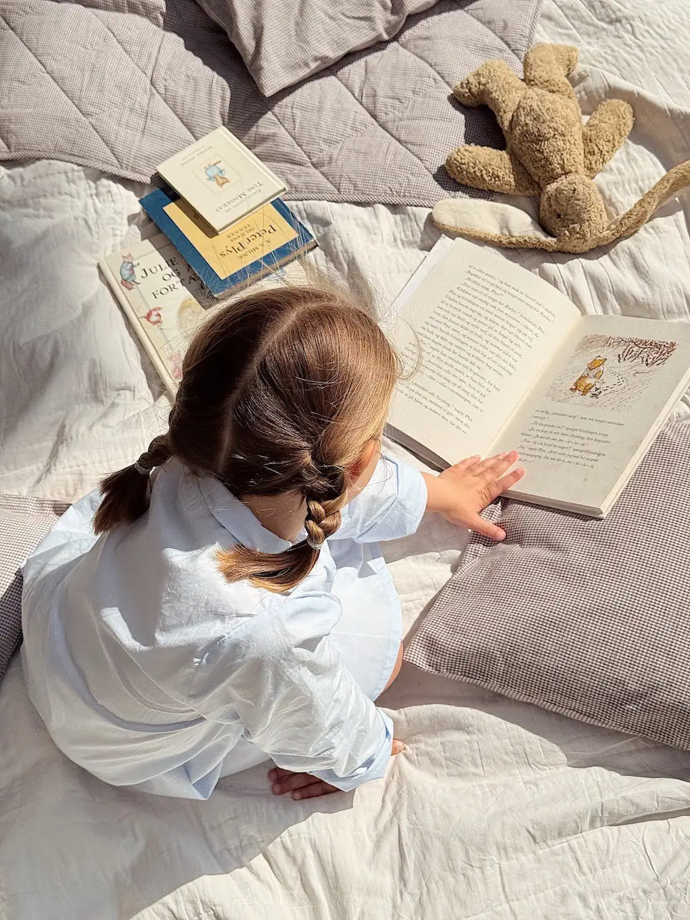 Girl wearing Lalaby summer pj dress for kids in sky blue organic cotton