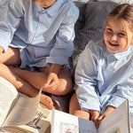 Boy and girl wearing Lalaby summer pyjamas and pj dress for kids in sky blue organic cotton