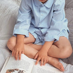 Boy wearing Lalaby summer pyjamas for kids in sky blue organic cotton
