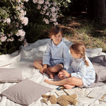 Boy and girl wearing Lalaby summer pyjamas and summer pj dress for kids in sky blue organic cotton