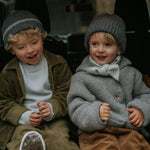 Girl wearing Lalaby Winston hat in storm grey cashmere